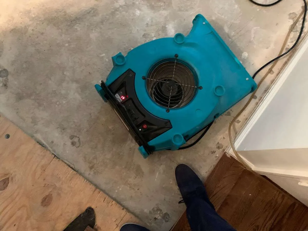 Air mover drying subfloor during Leak Detection & Repair in Red Lion